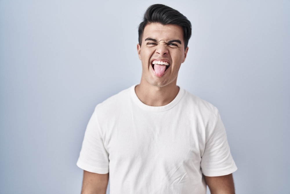 Image of a guy showing his tongue