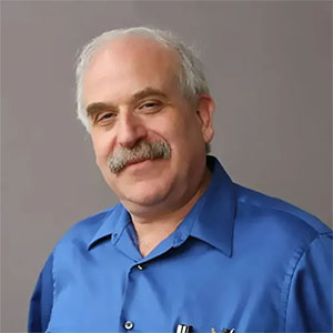 Dr. Joel Morris wearing blue polo