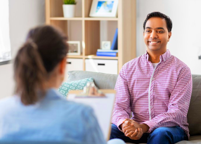 Male patient talking to her therapist