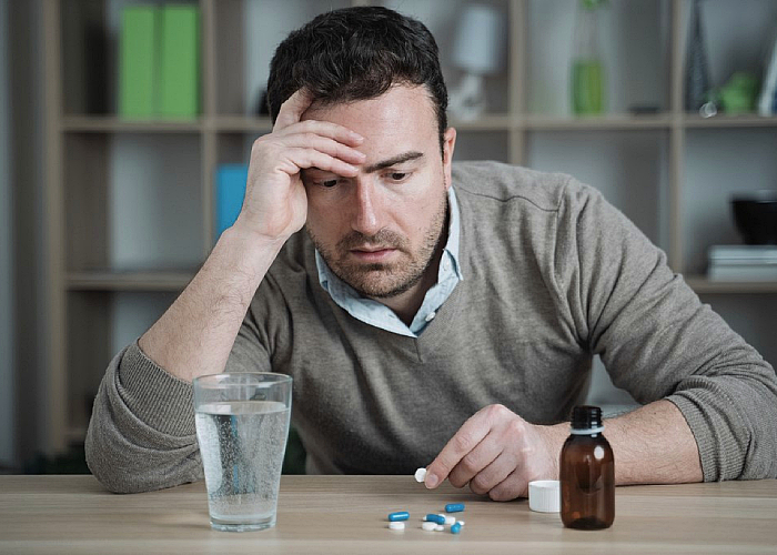 A guy taking his medication