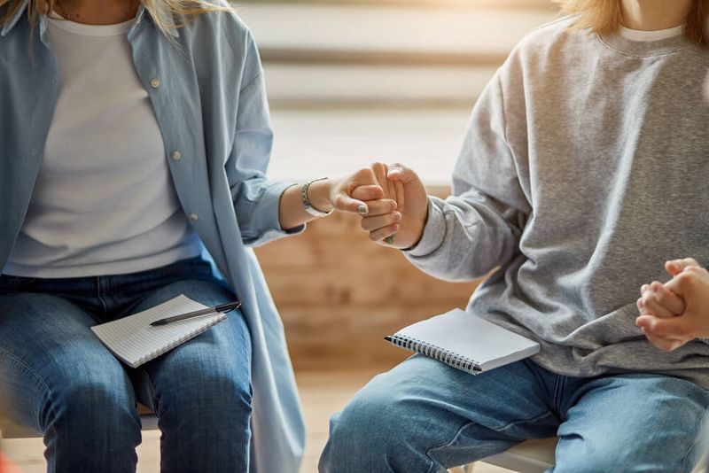 man and a woman holding hands