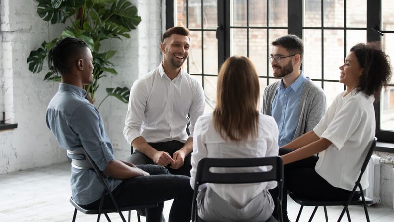 Group of individuals having a group meeting