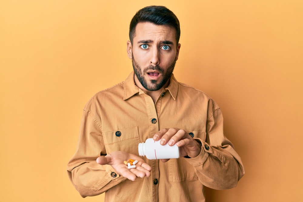 A man holding xanax bar in surprised with open mouth