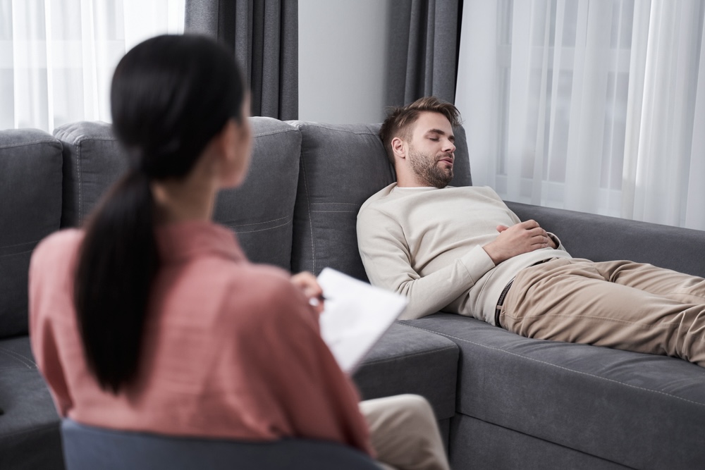 Man lying on the couch during a therapy session