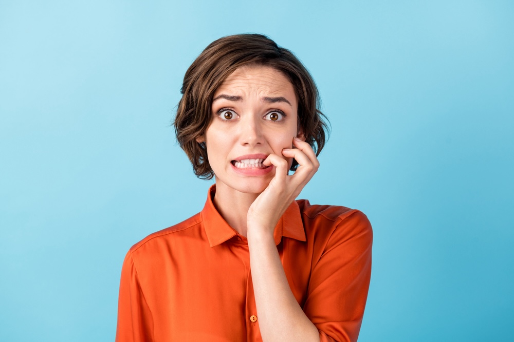 Woman in a red shirt afraid about what will happen to her life after rehab